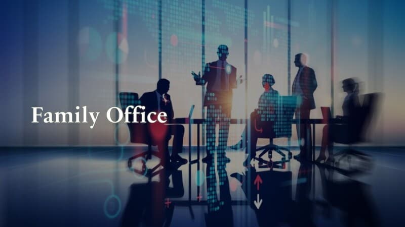 Family Office, over a meeting of silhouetted people.