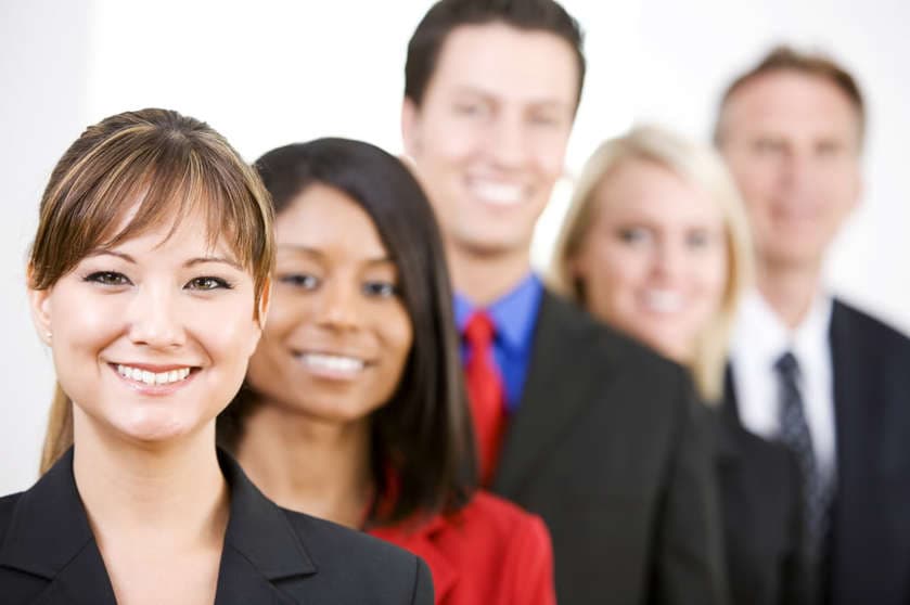 A group of smiling business professionals.